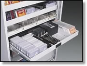 Roll out shelf for storage of multi media